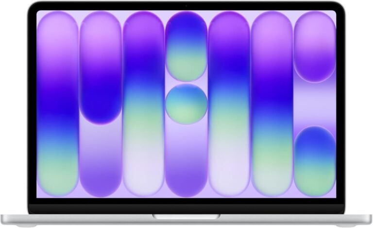 Silver laptop open and displaying a purple, blue, and green abstract gradient wallpaper with rounded pill-shaped patterns on the screen.